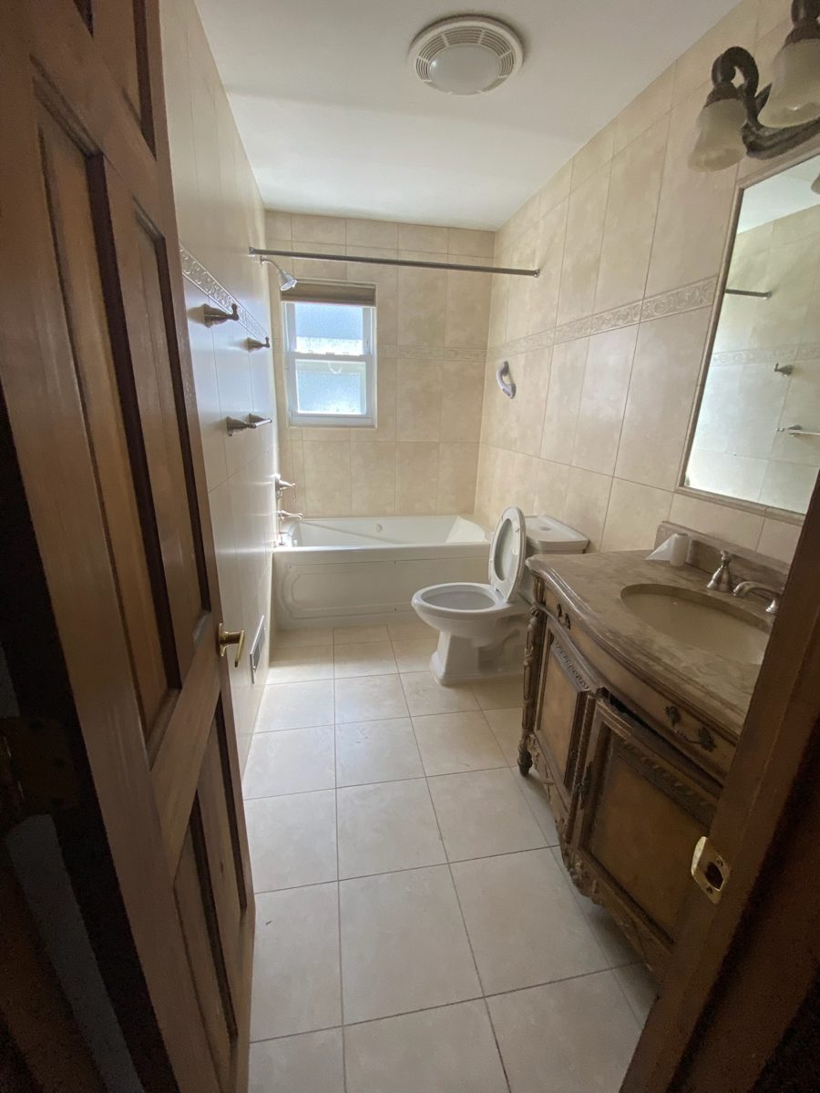 Dated bathroom before the full remodel
