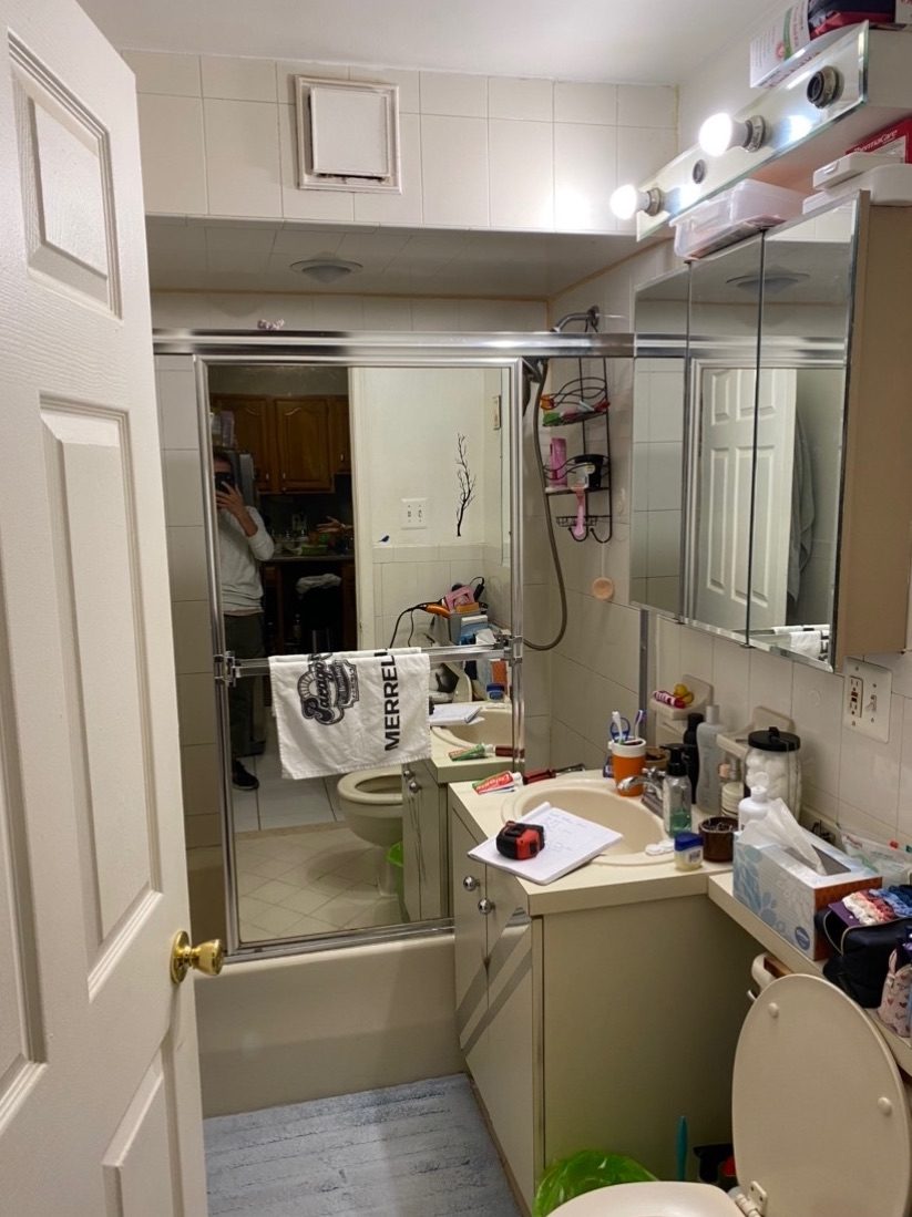 Cramped, dated bathroom before the remodel